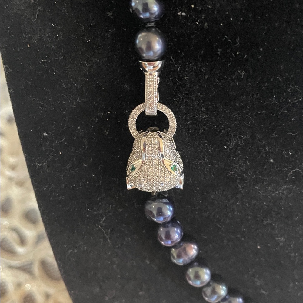 Elegant Black Pearl Necklace with a tiger clasp